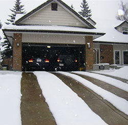 Heated driveway with two heated tire tracks.