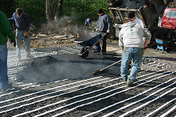 Installing a heated driveway in asphalt.