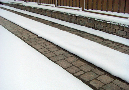 Driveway with heated paver tire tracks.