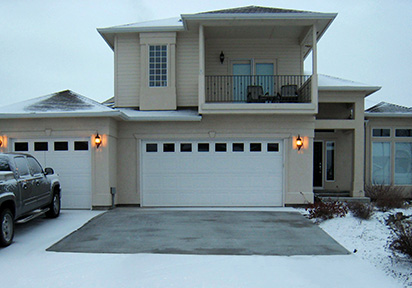 A concrete driveway retrofitted with a radiant snow melting system.