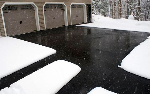 Heated driveway and walkways in asphalt.